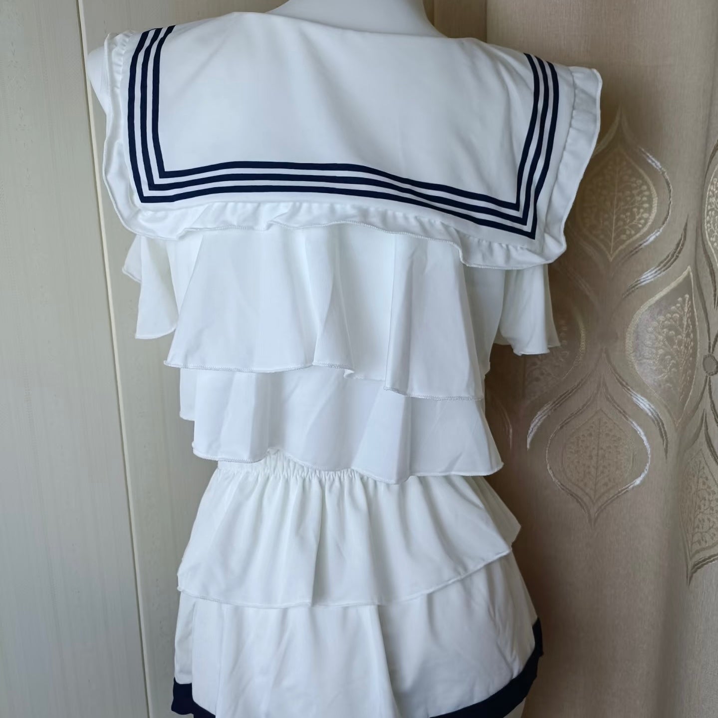 White sailor lingerie set on a mannequin against a white background