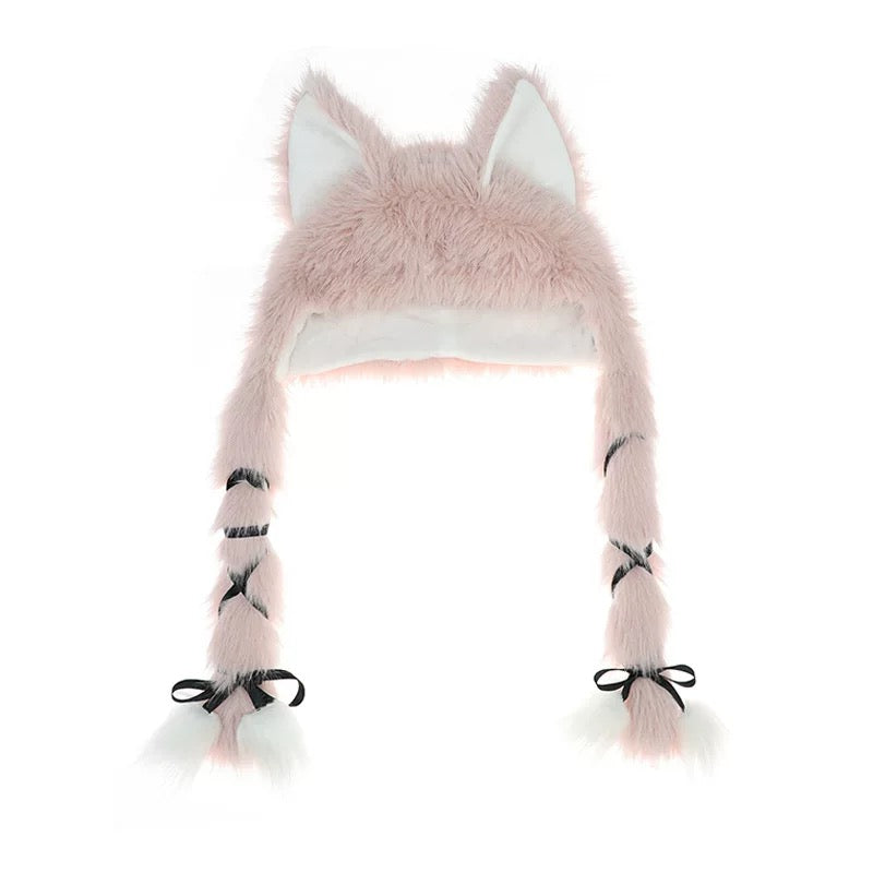 Pink fluffy animal hat with ears and tail on a white background