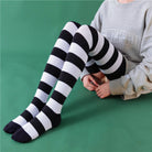 80cm extra long femboy in black and white striped thigh high socks