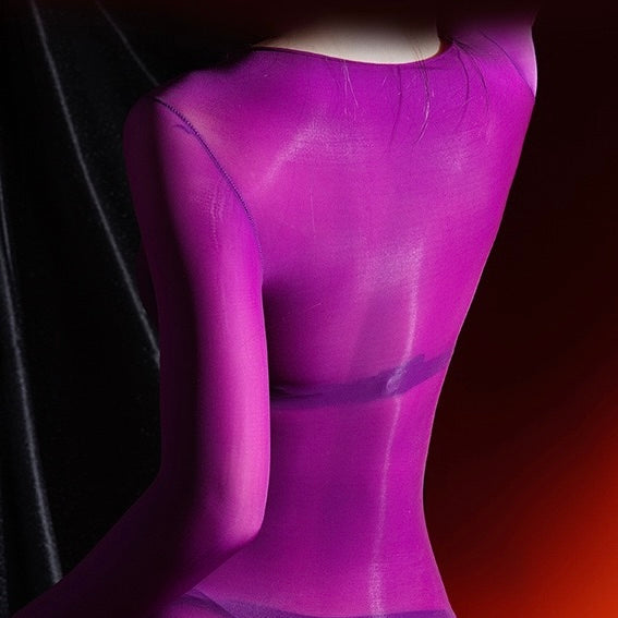 Close-up of a purple mannequin against a dark background