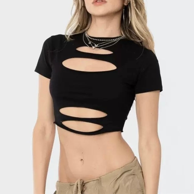 Black crop top with cut-out design worn by a model on a white background