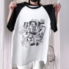 Person holding a white baseball shirt with black sleeves featuring a graphic design.