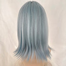 Light blue wig on a mannequin head against a white background
