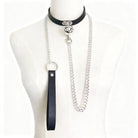Black leather and silver chain choker necklace on a mannequin neck.
