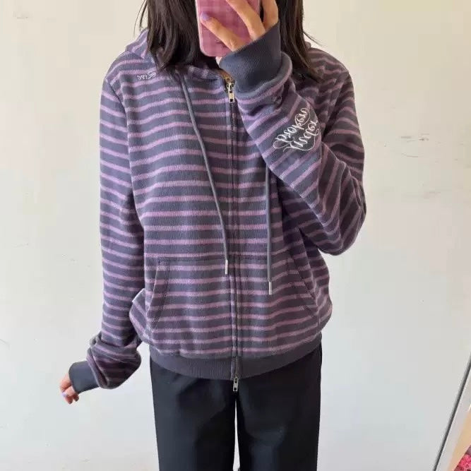 Lavender hoodie with lace details on sleeves and front pocket, hanging against a white background.