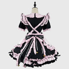 Black and pink maid dress on a mannequin against a white background