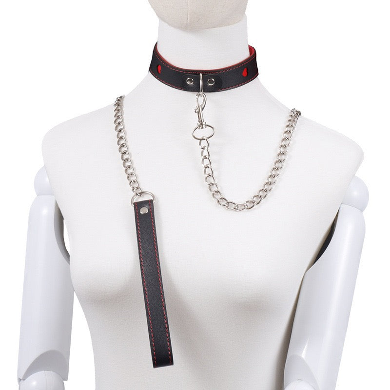 Red and black leather collar with chain on a white background