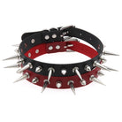 Black and red spiked dog collar on a white background