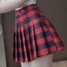 Red and navy plaid skirt on a plain background