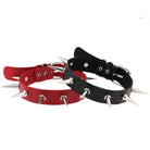 Red and black spiked leather chokers on a white background