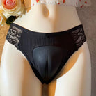 Black lace underwear on a mannequin with a blurred floral background