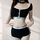 Black sports bra and shorts set with 'SPORT' branding on a neutral background