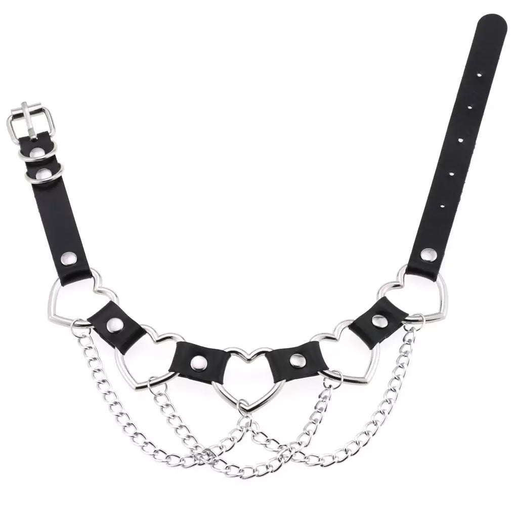 Black leather choker with metal chain and heart designs on a white background