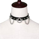 Black leather choker with silver chain links on a mannequin bust.