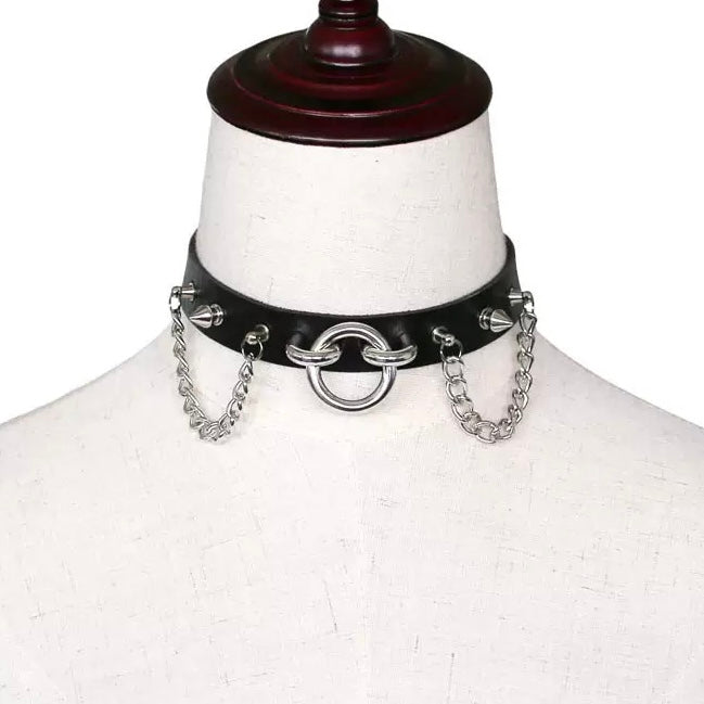 Black leather choker with silver chain links on a mannequin bust.