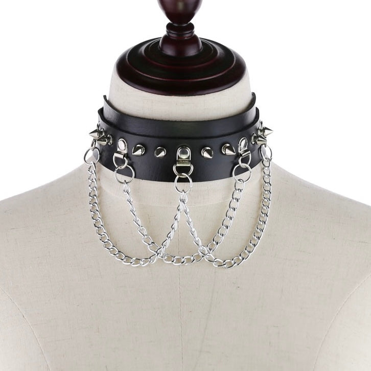 Black gothic leather studded choker with chain on a mannequin bust.