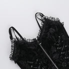 Black gothic zip-up corset top on a white background
