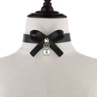Black leather choker with a silver bell on a mannequin bust.