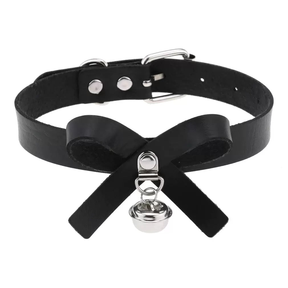 Black leather choker with silver bell on a white background