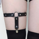 Femboy wear a black leather o ring thigh garters