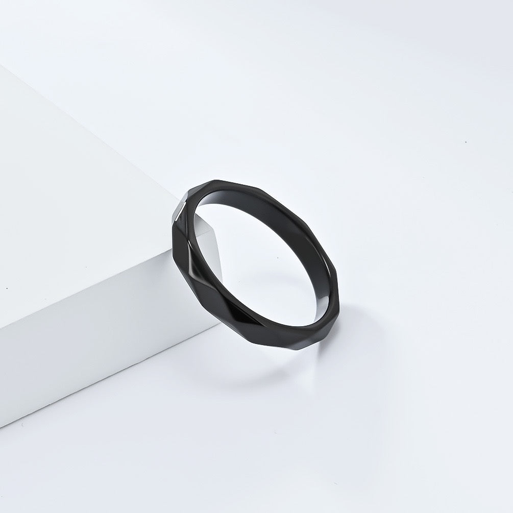 Black minimalist rhombus stainless steel ring band on a white background