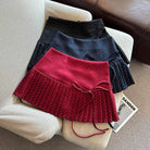 Three polka dot pleated skirts