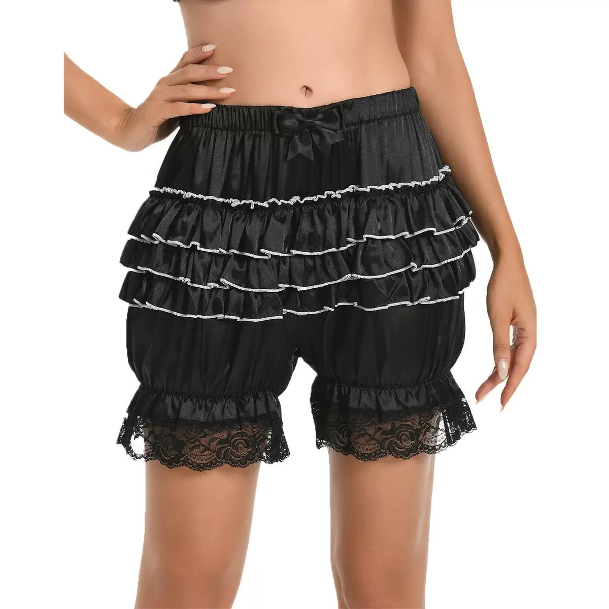 Black ruffled shorts with lace trim on a white background