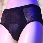 Black lace underwear worn by a person on a floral background