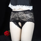 Black lace underwear with white lace waistband on a black background
