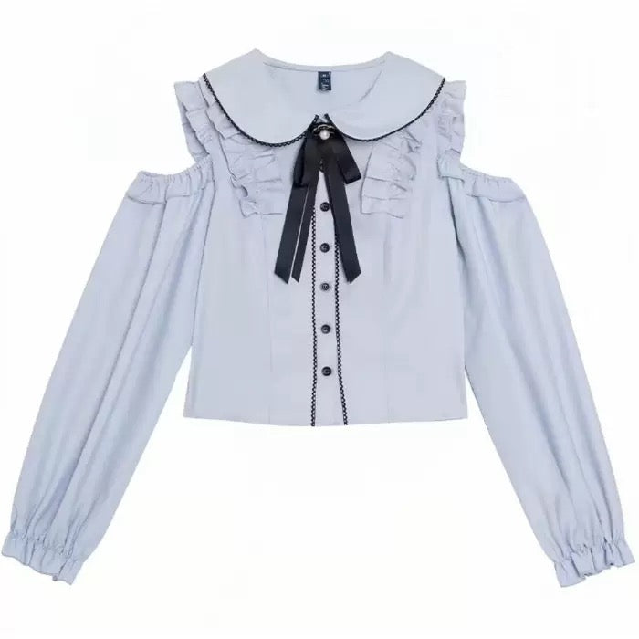 Light blue blouse with black collar and bow on a white background