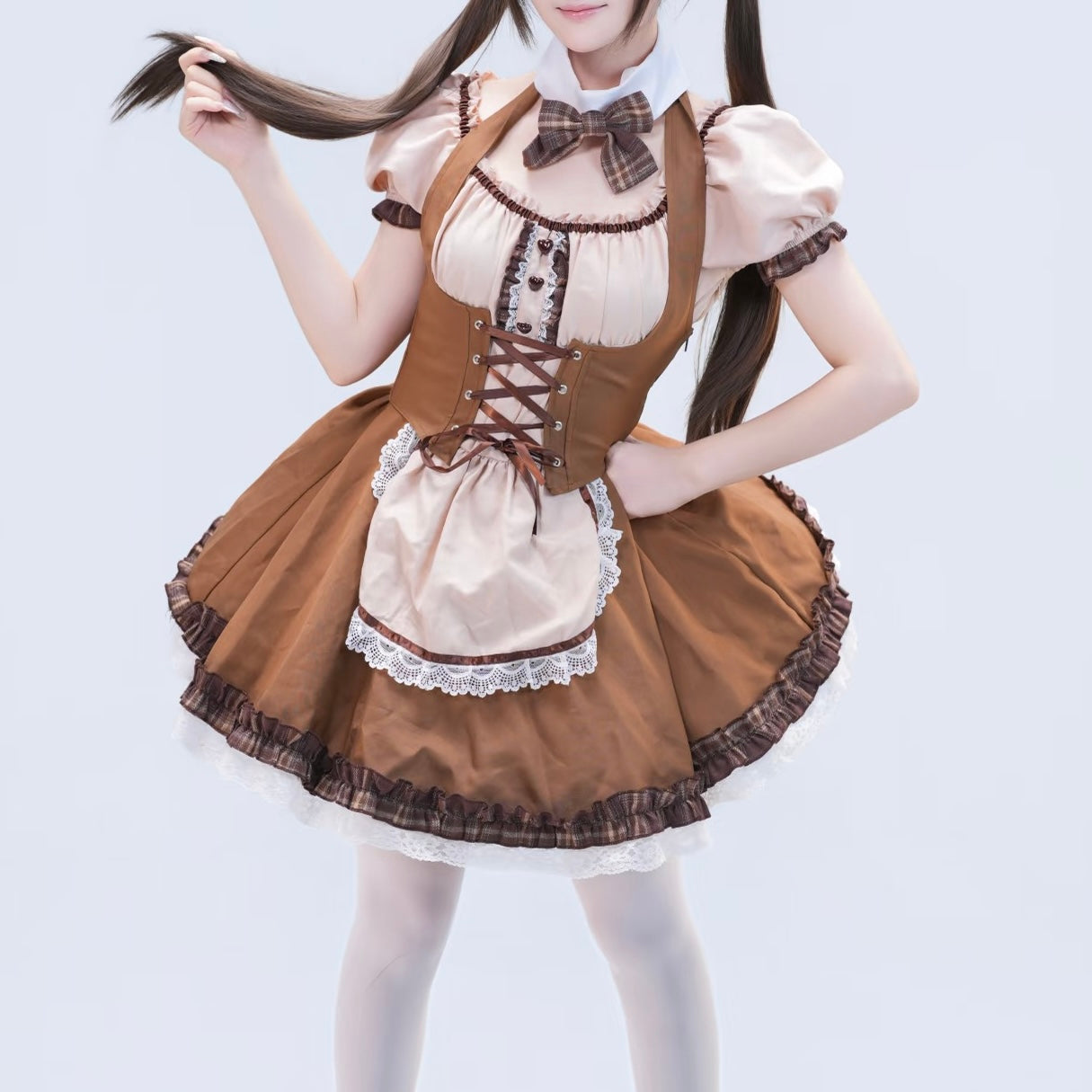 Femboy wearing a brown and beige maid outfit on a light gray background