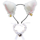 White faux fur bunny ears headband with pink inner lining, white bows, small gold bells, and a matching white ruffled collar with a silver bell and ribbon, shown on a plain white background.