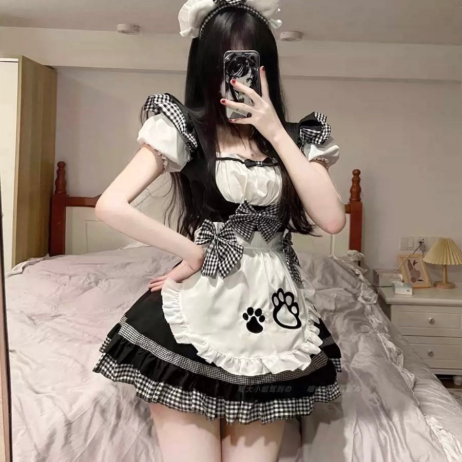 Person wearing a cat femboy cosplay maid dress