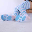 Blue and white striped socks with paw prints on a light gray background
