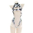 Black and white cow print hollow out bodysuit lingerie on a mannequin against a white background