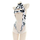 Black and white cow print hollow out bodysuit lingerie on a mannequin against a white background