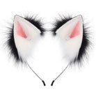 Pair of white cat ears with black fur and pink inner lining on a white background