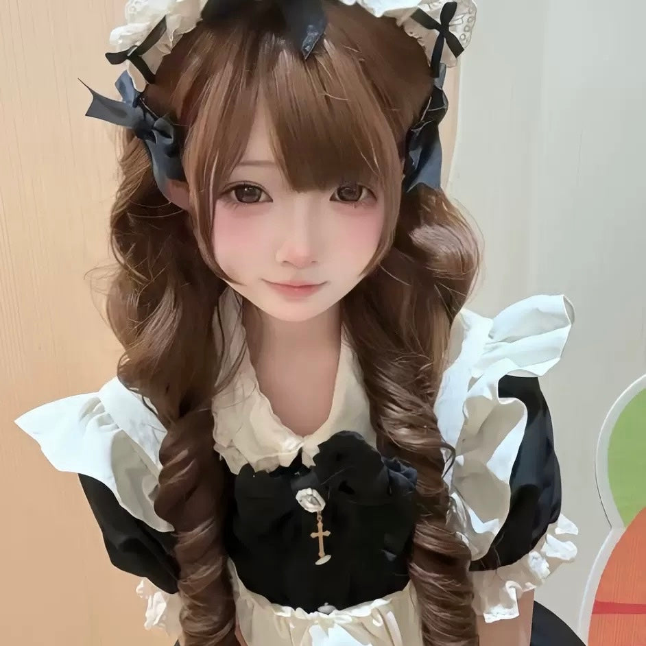 Person wearing a maid outfit with a white headband and black gloves.