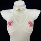 Person wearing a sports-themed outfit with a crop top and skirt in a room.