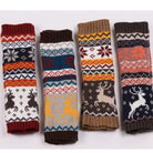 Four pairs of elk fingerless knit arm warmers with festive patterns on a white background