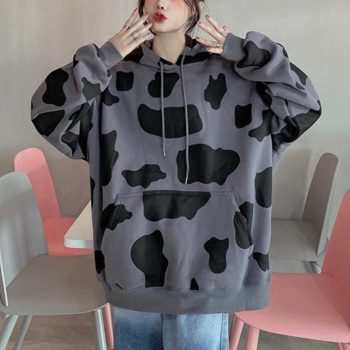 Femboy in black and gray oversize cow print hoodie