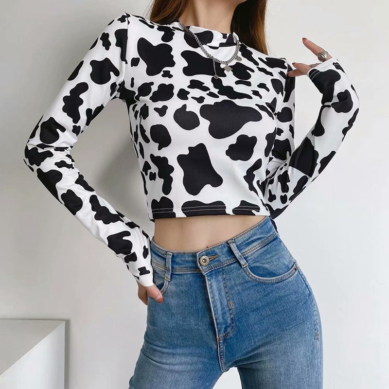 Femboy in cow print long sleeve crop top