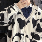 Femboy in cow print zip up hoodie detail