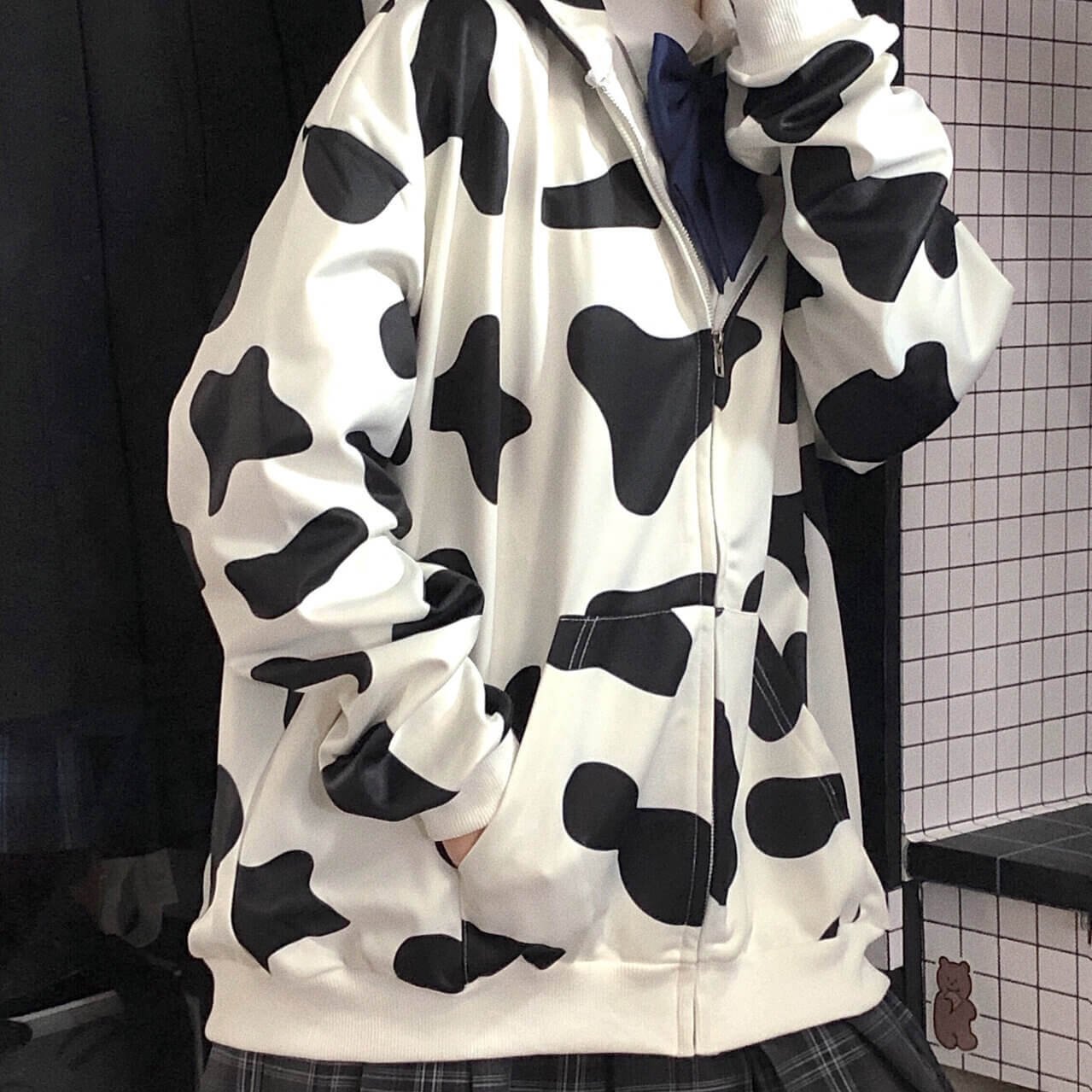 Femboy in cow print zip up hoodie front