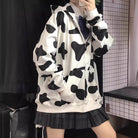 Femboy in cow print zip up hoodie side