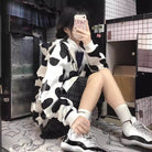 Femboy in cow print zip up hoodie