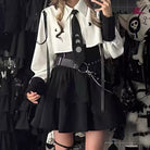Femboy in gothic white shirt and skirt set