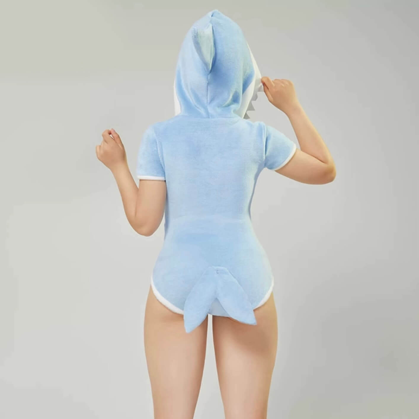 Femboy in kawaii shark bodysuit back