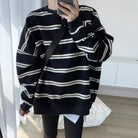 Femboy in oversize black and white striped long sleeve top