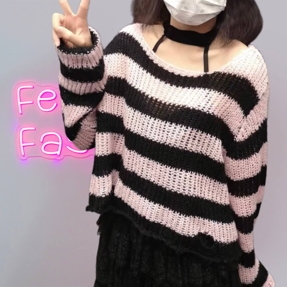 Femboy in pink and black striped distressed crop sweater with black skirt